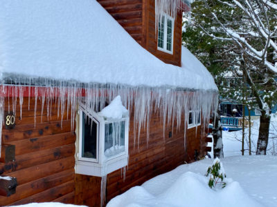 Winter home covered in snow and ice