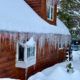 Winter home covered in snow and ice