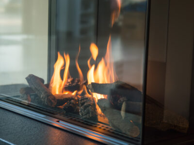 Fire burns in a natural gas glass fireplace