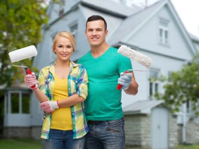 Couple painting house