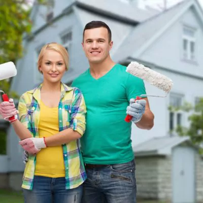 Couple painting house