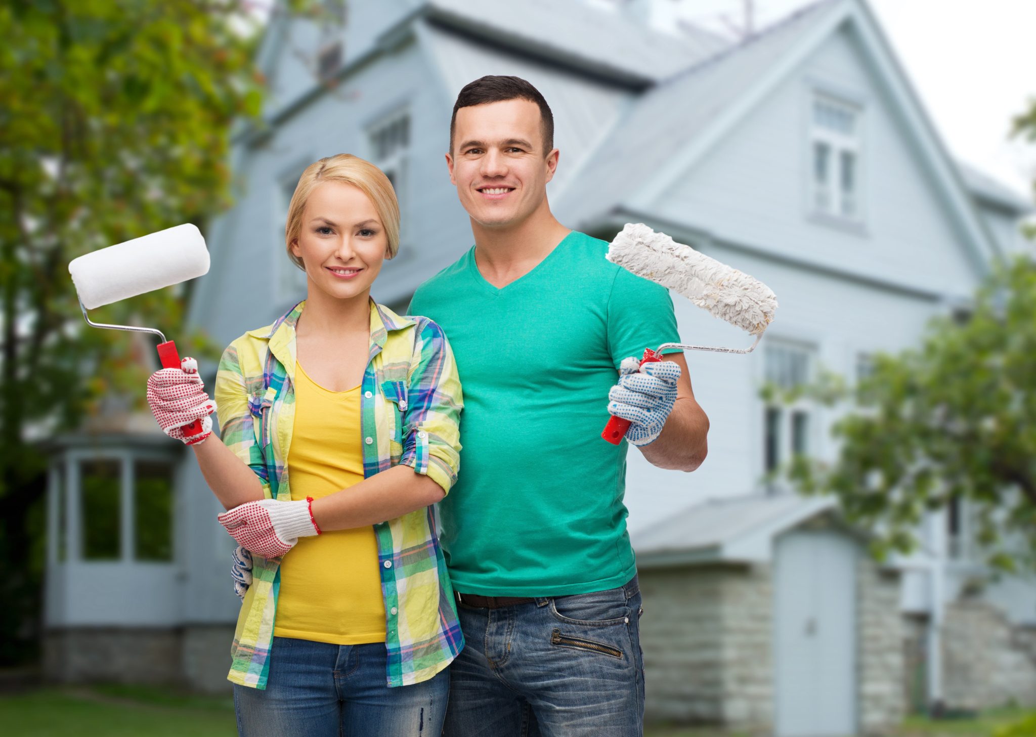 Couple painting house