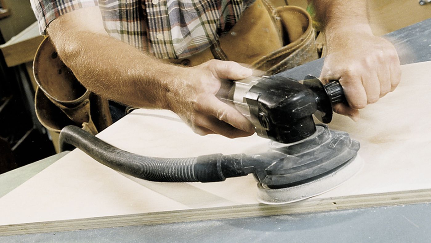 man using sanding machine