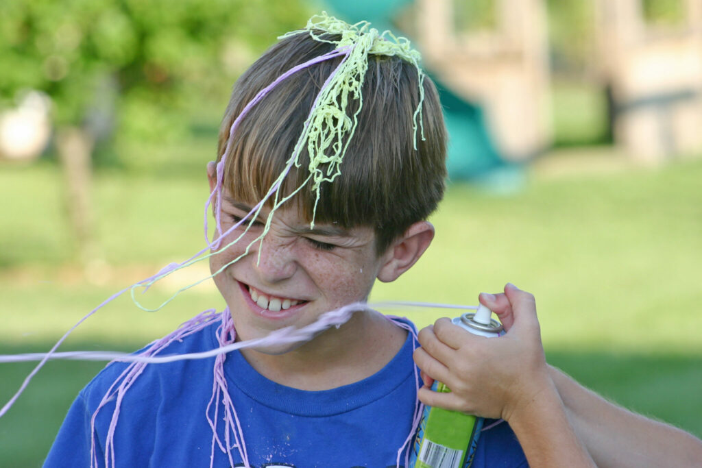Boy playing with silly string