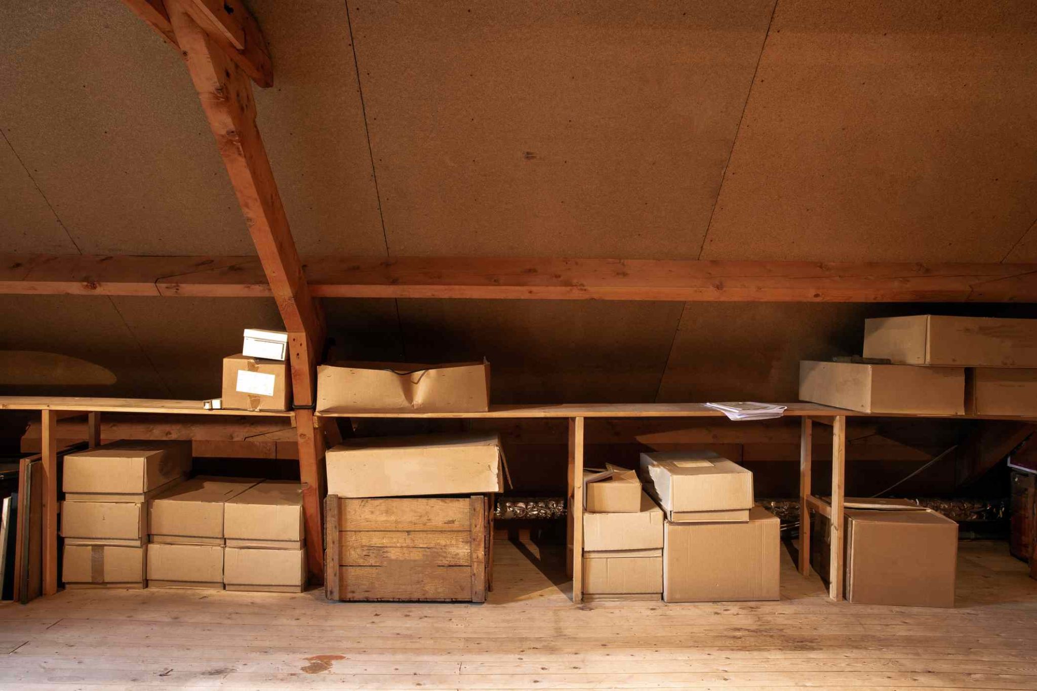 simple attic storage filled with a couple boxes