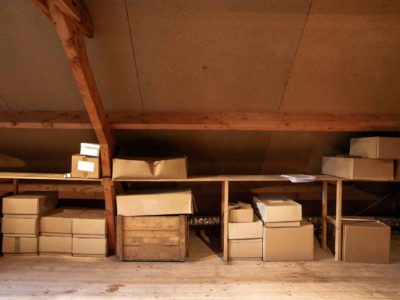simple attic storage filled with a couple boxes