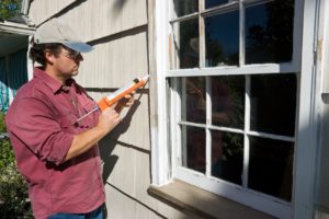 Seal out drafts by caulking around a window