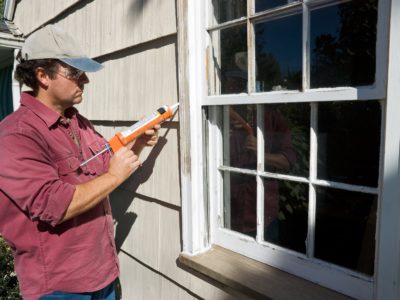 Seal out drafts by caulking around a window