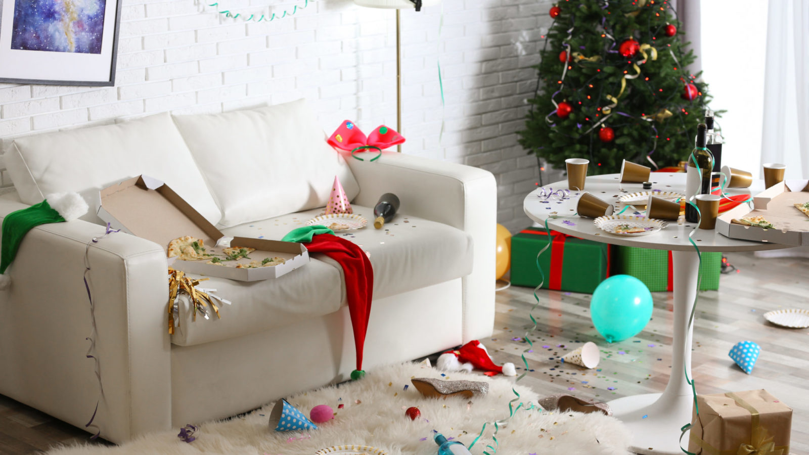 Messy living room interior with Christmas tree