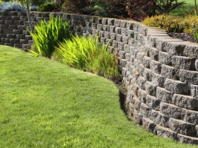 retaining wall with grass and landscape