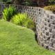 retaining wall with grass and landscape