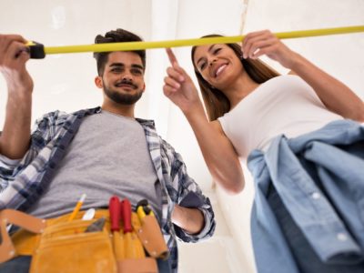 Young couple taking measurements