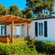 Closeup of a mobile home with a deck lanai