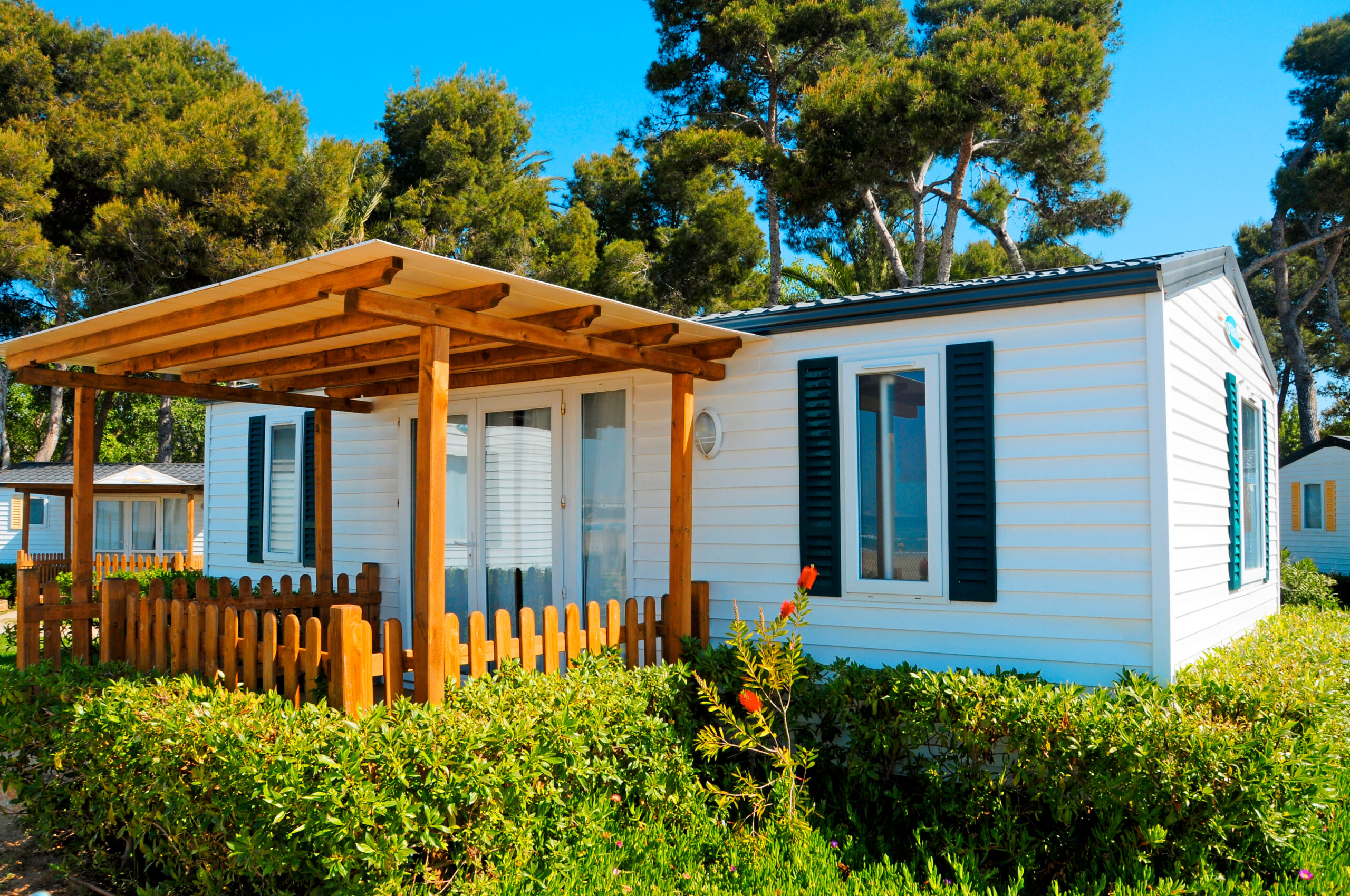 Closeup of a mobile home with a deck lanai