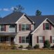 house with shutters over vinyl siding