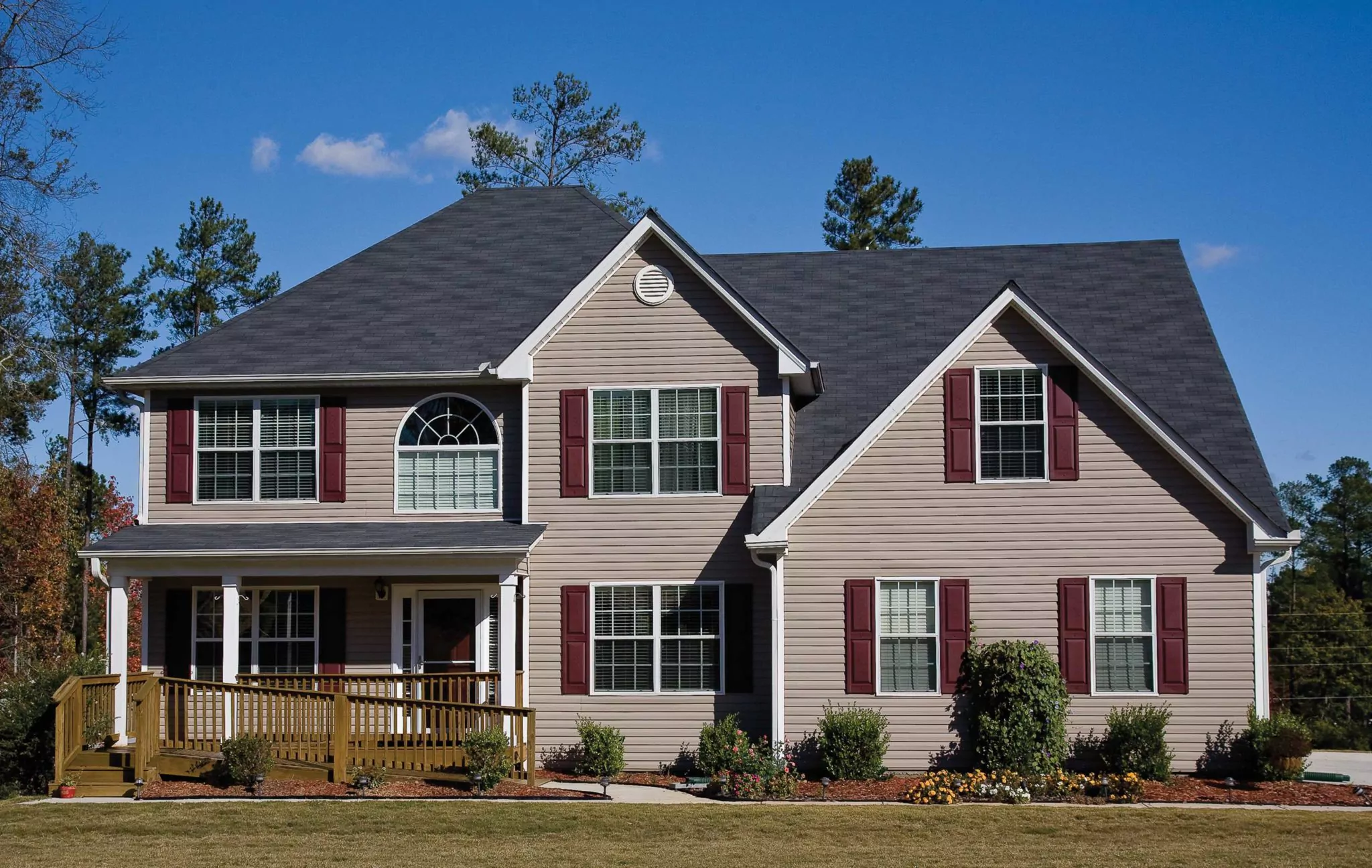 house with shutters over vinyl siding