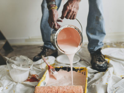 Pouring paint into a paint tray