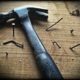 Black claw hammer on old wood plank