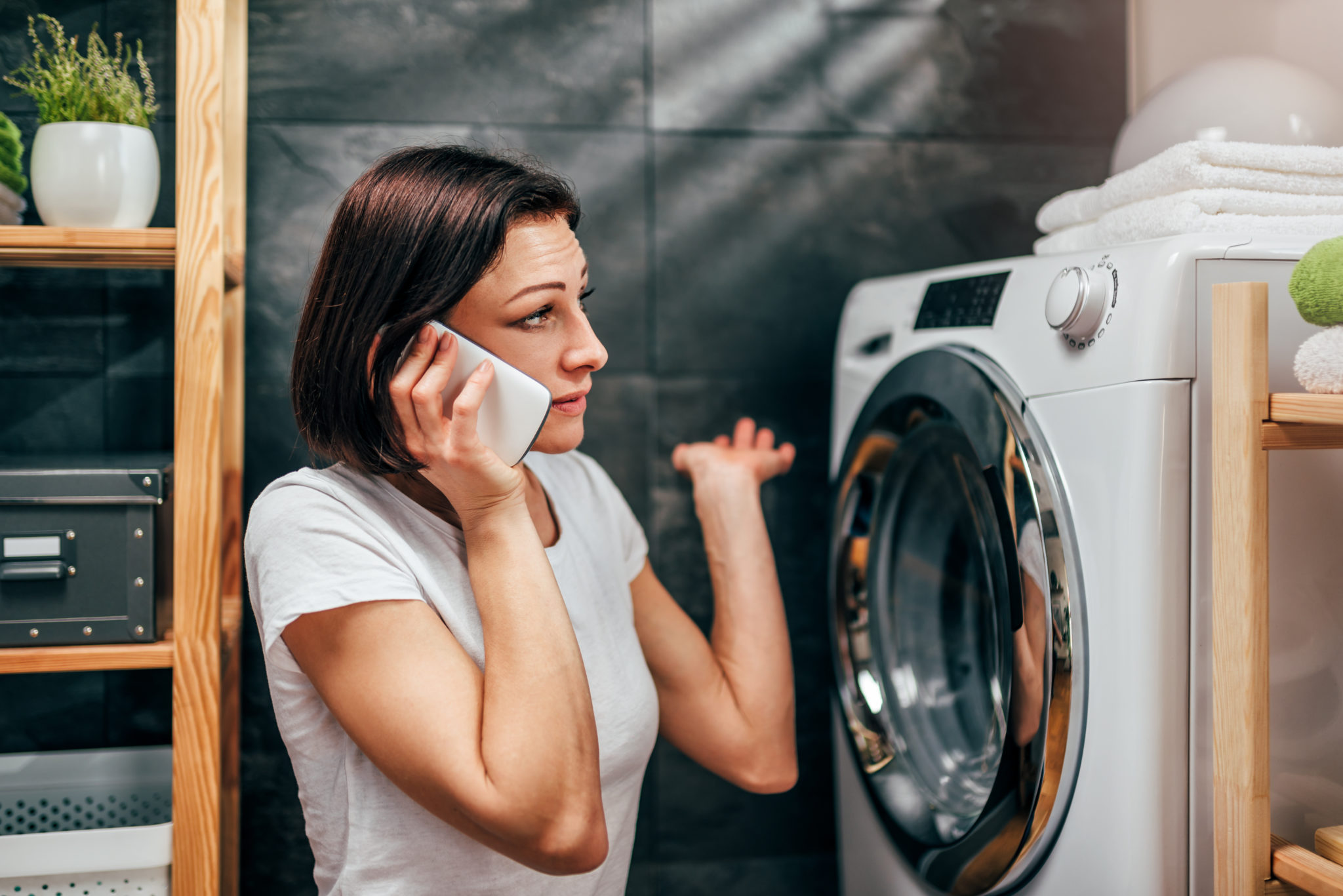 Woman calling for appliance repair service