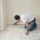 Man installing vinyl flooring