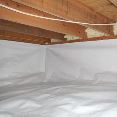 Crawlspace under a house with vapor barrier installed