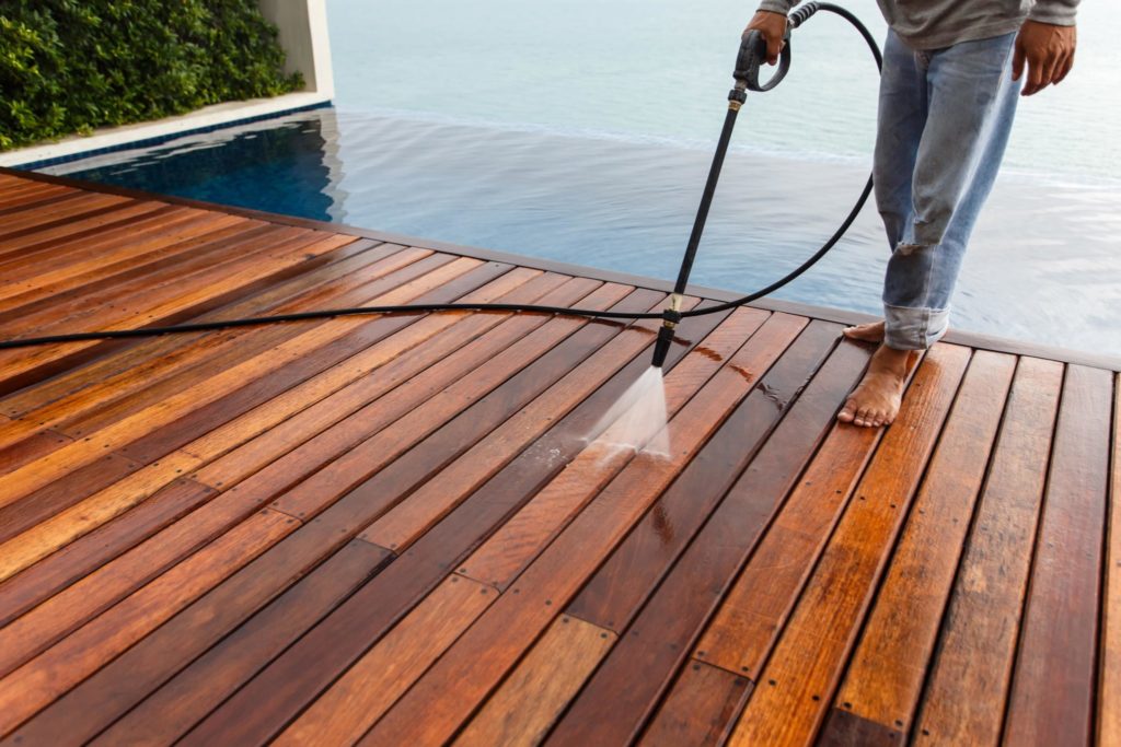 Cleaning wood deck with a pressure washer