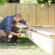 Man building a backyard deck