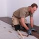 Man installs a laminate floor