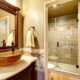 vanity, Bathroom interior in luxury house. Rich bathroom vanity cabinet with vessel sink and mirror. View of shower. Northwest, USA