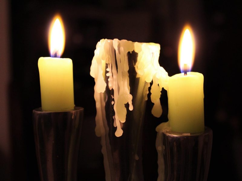 Dripping lit candle