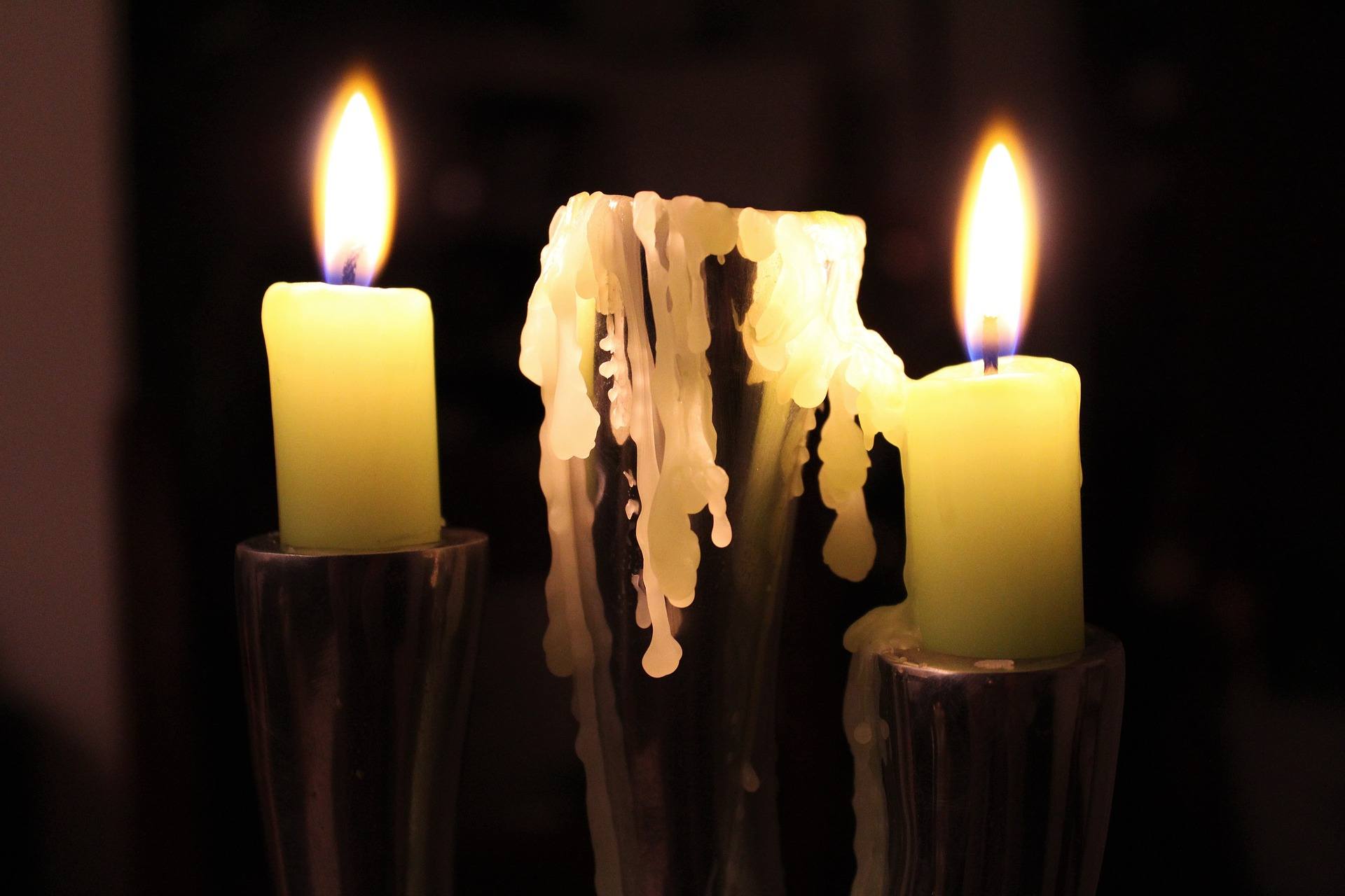 Dripping lit candle