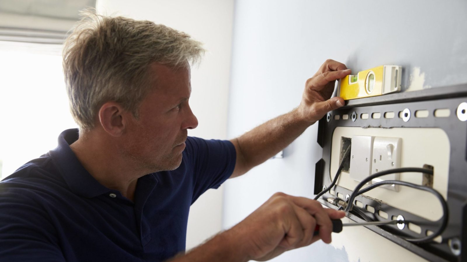 How to Hang a Flat Screen TV and Make Wires Mysteriously Disappear