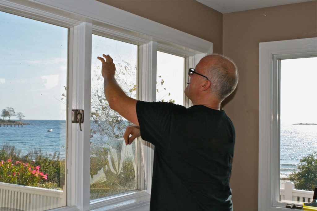 Contractor installing window