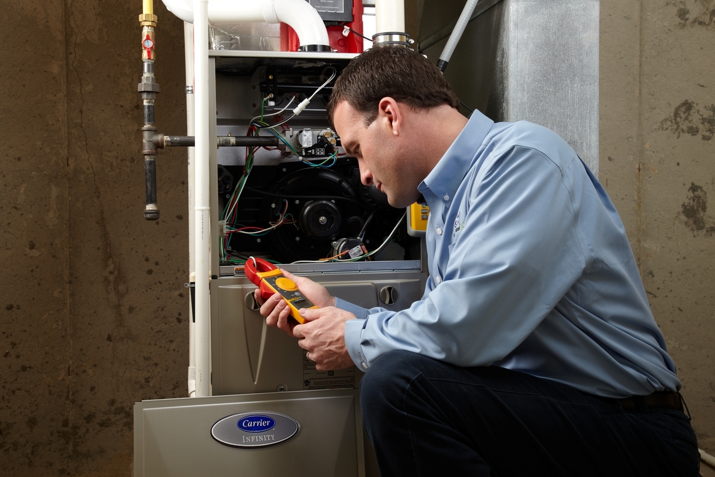 Heating technician servicing a furnace