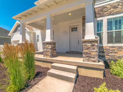 Home with a concrete porch and steps