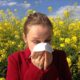 Woman sneezing during allergy season