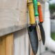 Garden tools hung up in a shed