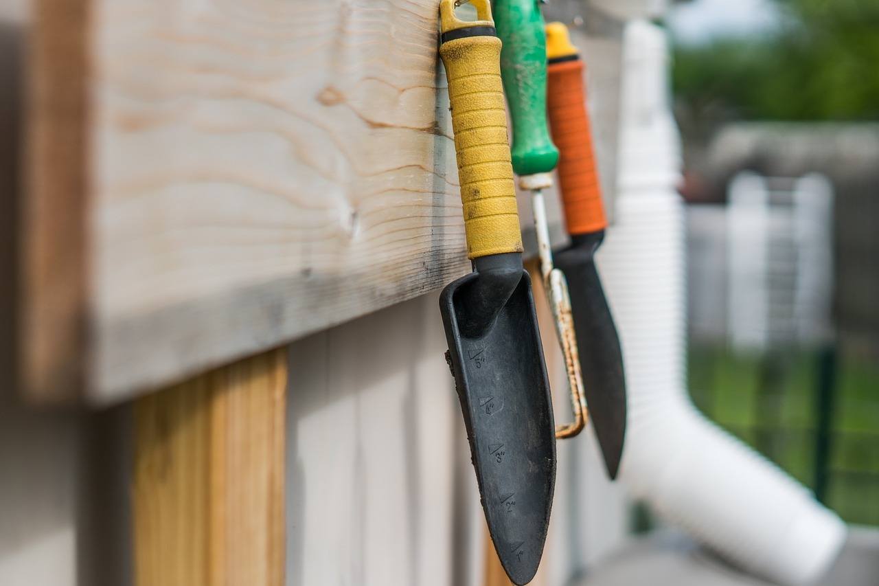 Garden tools hung up in a shed