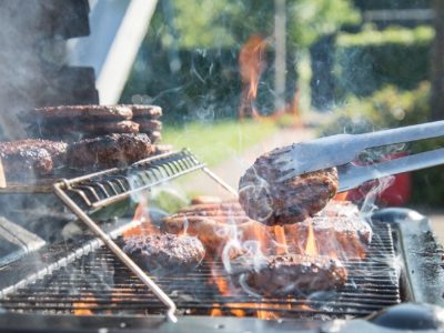 Gas grill with burgers