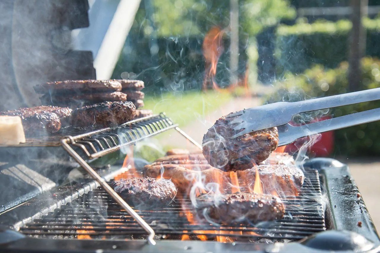 Gas grill with burgers