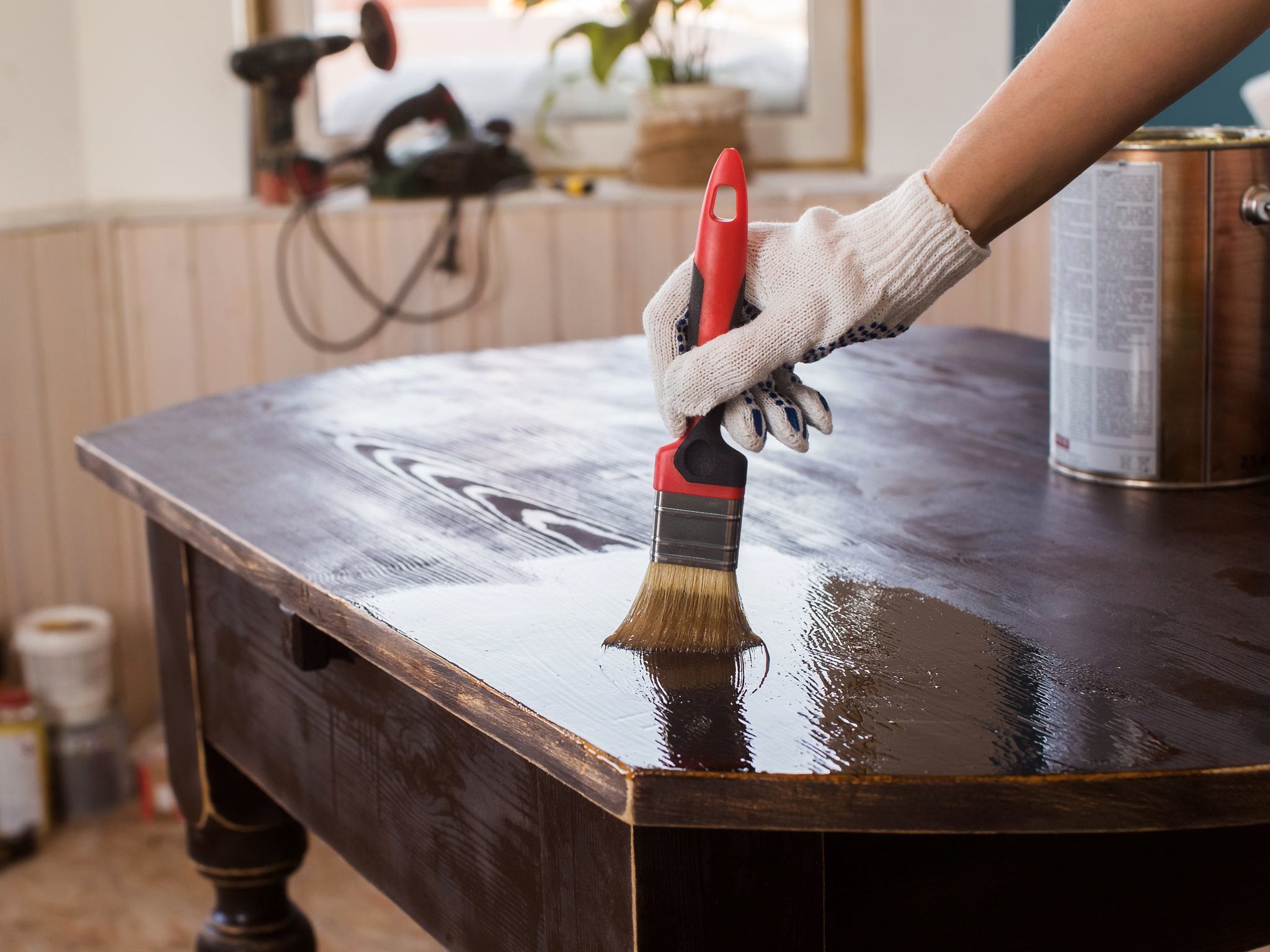 Person refinishing old furniture