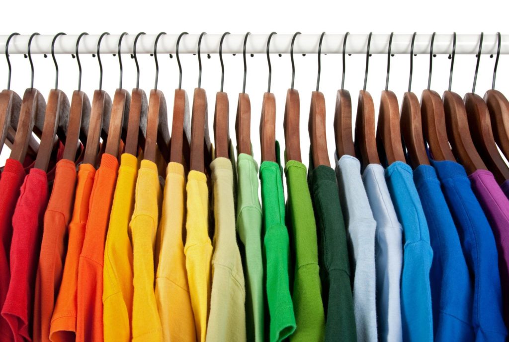 Organized closet with t-shirts on hangers