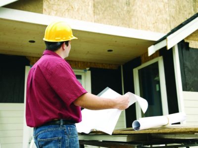Contractor reviewing a project under construction