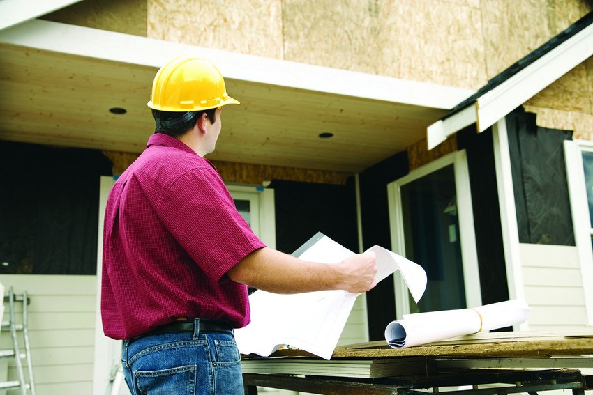 Contractor reviewing a project under construction