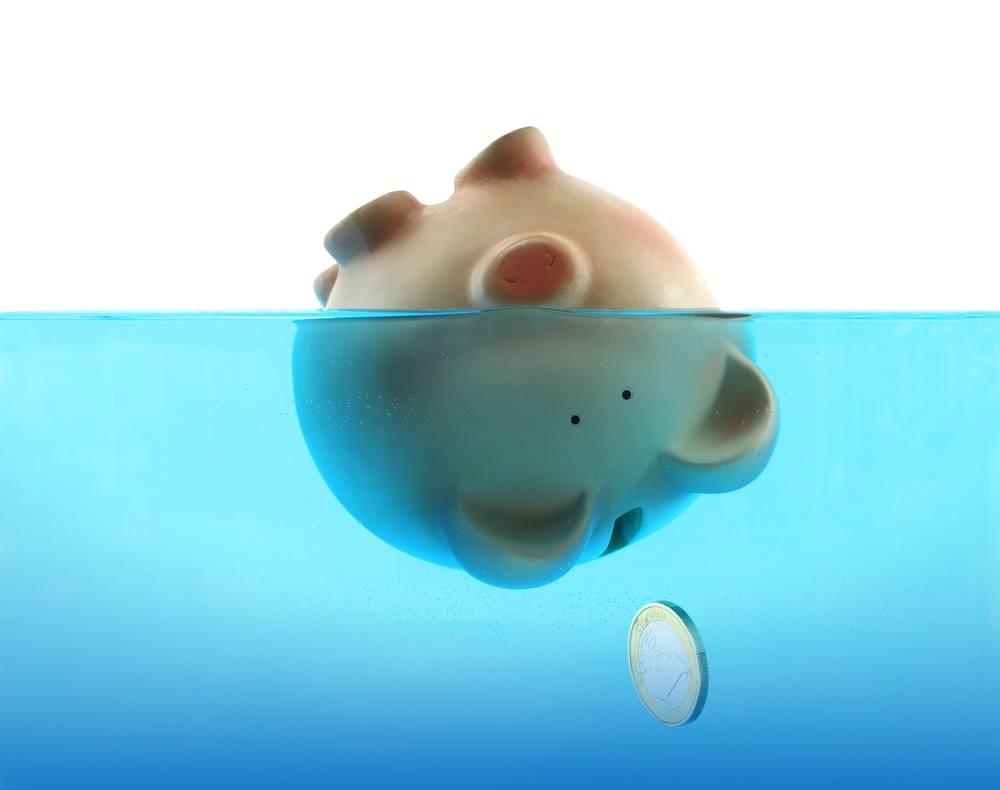 page_05_piggy_bank_in_water_shutterstock_117536578