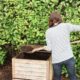 Woman creating compost for a garden