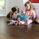 Child and dog sitting on EVP (engineered vinyl plank floor) which is durable and waterproof.