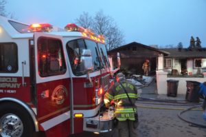 Fire trucks arrive at a home
