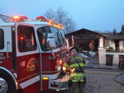 Fire trucks arrive at a home