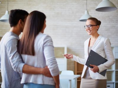 Couple looking at a home with a real estate agent